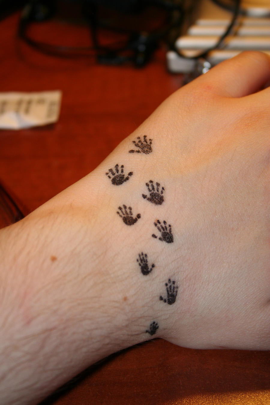 little hand tattoo by