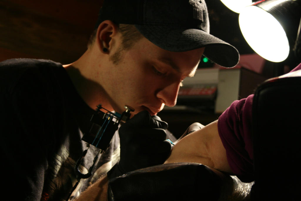 Tattoo Artist At Work - dragonfly tattoo