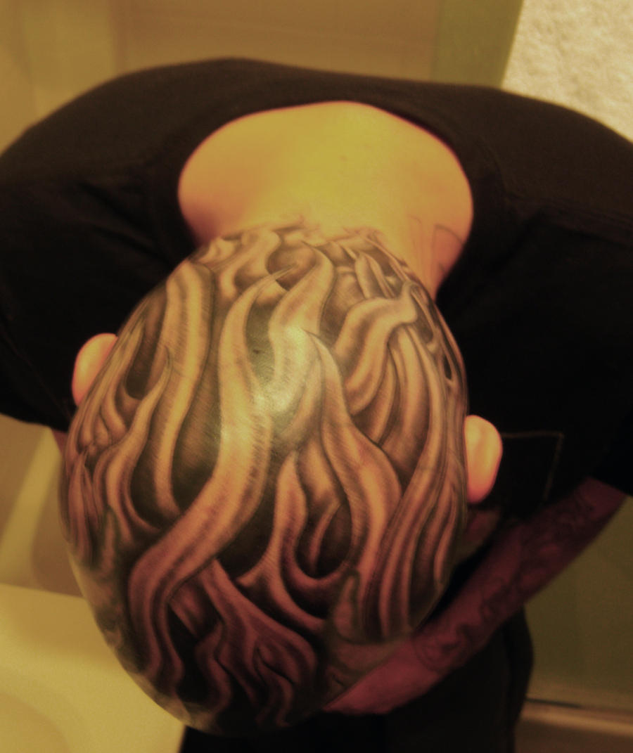 Flames tattoo on head by