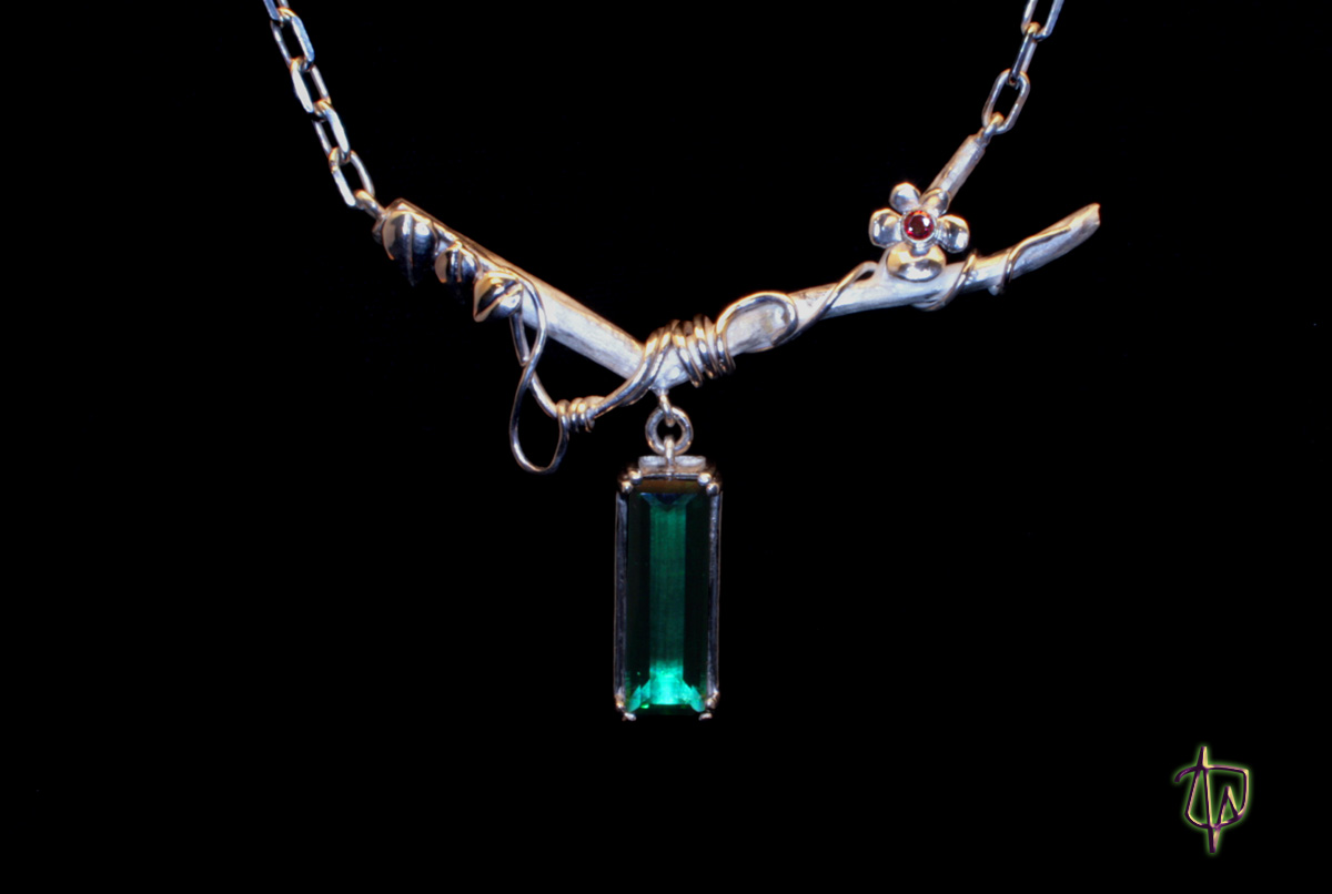 Summer Vines Pendant- Sterling silver, prasiolite, and an anthill garnet on a chain; 16.5"; pendant is 71.6MM wide and 58.5MM tall. Hand fabricated. 
