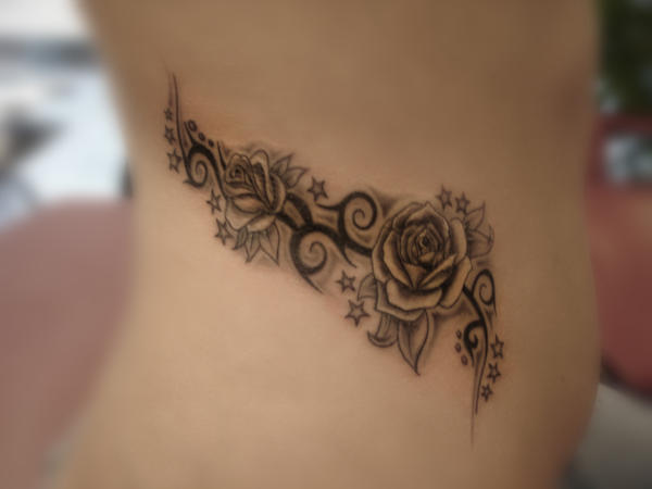 Tribal roses on side belly by