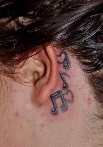 small tattoo designs behind ear. Music Notes ehind ear